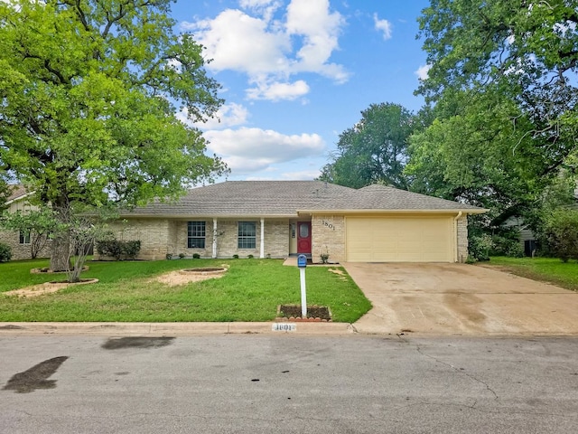 1801 Rock Creek Dr, Round Rock, TX 78681 - ranch-style home with an attached garage, driveway, a front lawn, and brick siding