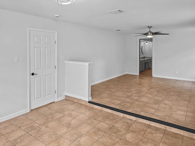 1801 Rock Creek Dr, Round Rock, TX 78681 - spare room with a ceiling fan and baseboards