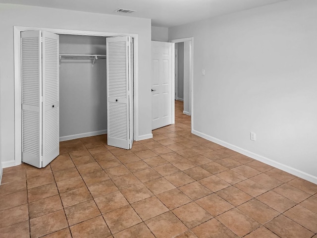 1801 Rock Creek Dr, Round Rock, TX 78681 - unfurnished bedroom featuring a closet, baseboards, and light tile patterned floors