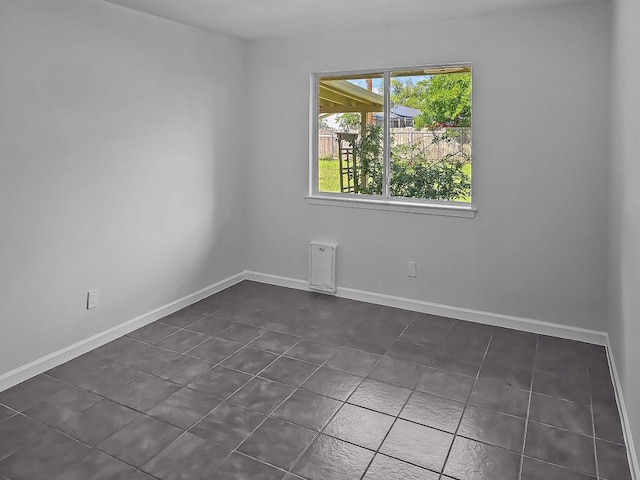1801 Rock Creek Dr, Round Rock, TX 78681 - empty room with baseboards and dark tile patterned floors