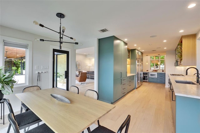 402 Buckeye Trl, West Lake Hills, TX 78746 - dining space featuring light wood finished floors and recessed lighting