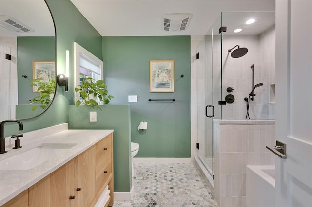 402 Buckeye Trl, West Lake Hills, TX 78746 - bathroom featuring baseboards, a shower stall, vanity, and toilet