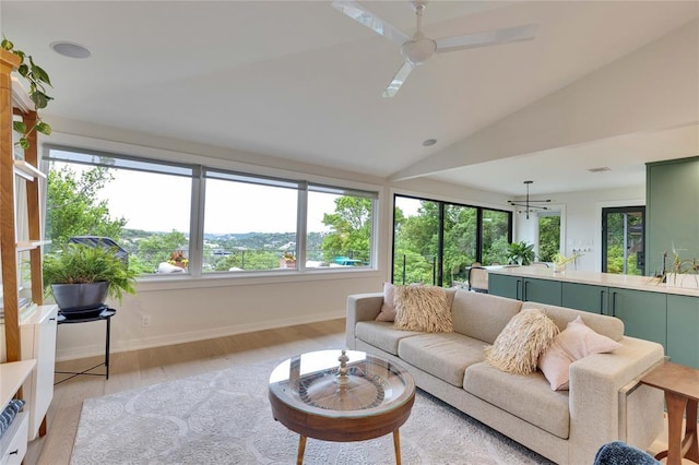 402 Buckeye Trl, West Lake Hills, TX 78746 - living area with lofted ceiling, light wood finished floors, baseboards, and a ceiling fan