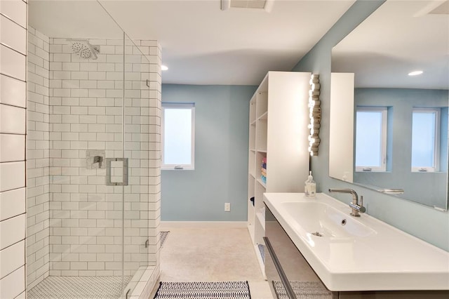 402 Buckeye Trl, West Lake Hills, TX 78746 - full bathroom featuring a sink, a shower stall, plenty of natural light, and recessed lighting