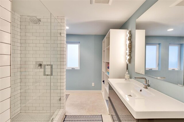 402 Buckeye Trl, West Lake Hills, TX 78746 - full bathroom with a shower stall, healthy amount of natural light, vanity, recessed lighting, and baseboards