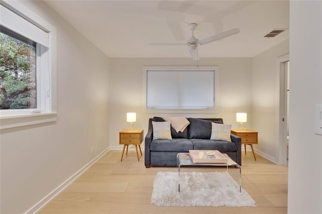 402 Buckeye Trl, West Lake Hills, TX 78746 - living room featuring light wood-type flooring, ceiling fan, and baseboards