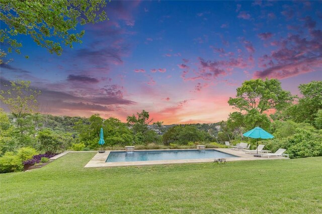 402 Buckeye Trl, West Lake Hills, TX 78746 - pool at dusk with a yard, a patio, and an outdoor pool