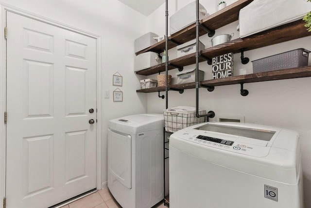 418 Rosedale Blvd, Georgetown, TX 78628 - clothes washing area featuring washer and clothes dryer and light tile patterned floors