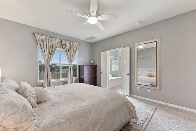 418 Rosedale Blvd, Georgetown, TX 78628 - carpeted bedroom featuring baseboards, ensuite bathroom, and a ceiling fan