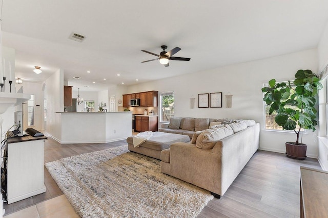 418 Rosedale Blvd, Georgetown, TX 78628 - living area with ceiling fan, light wood-style floors, baseboards, and recessed lighting