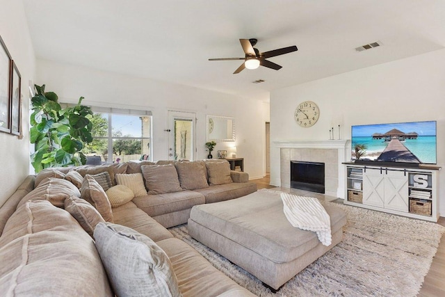 418 Rosedale Blvd, Georgetown, TX 78628 - living area with a ceiling fan, wood finished floors, and a tile fireplace