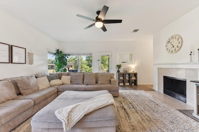 418 Rosedale Blvd, Georgetown, TX 78628 - living room with a ceiling fan, a fireplace, light wood-style flooring, and baseboards
