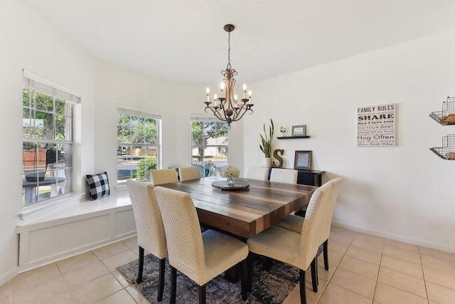 418 Rosedale Blvd, Georgetown, TX 78628 - dining room featuring a chandelier, light tile patterned floors, and baseboards