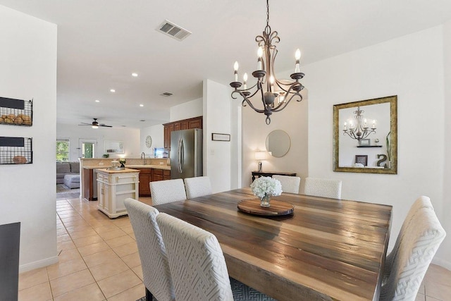 418 Rosedale Blvd, Georgetown, TX 78628 - dining area featuring a chandelier, light tile patterned floors, recessed lighting, a ceiling fan, and baseboards