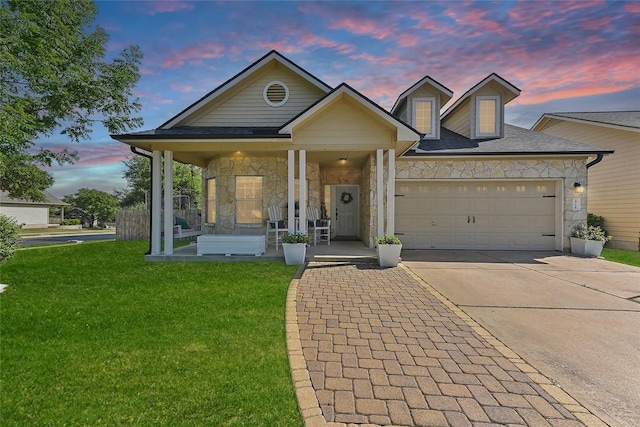 418 Rosedale Blvd, Georgetown, TX 78628 - view of front of home with stone siding, a garage, a yard, and driveway