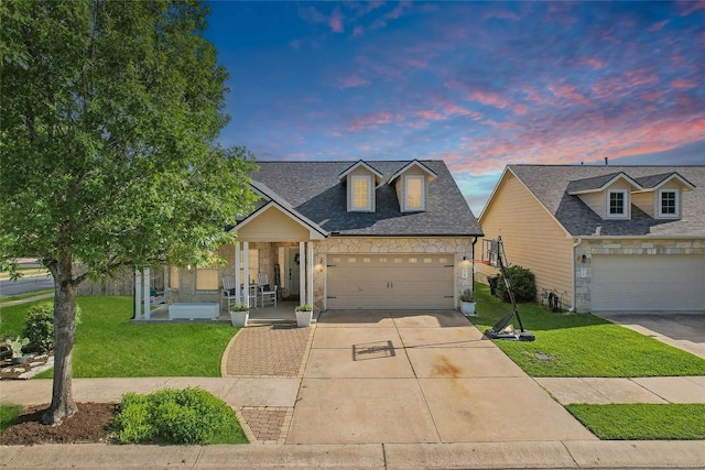 418 Rosedale Blvd, Georgetown, TX 78628 - traditional-style house featuring a porch, a yard, driveway, and stone siding