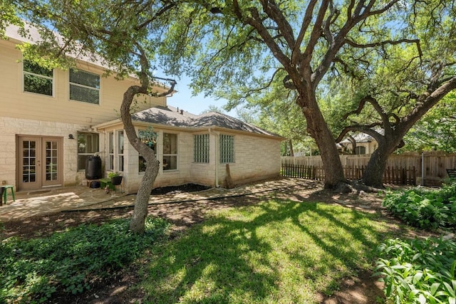10216 Chaska Cv, Austin, TX 78739 - rear view of house with french doors and a patio