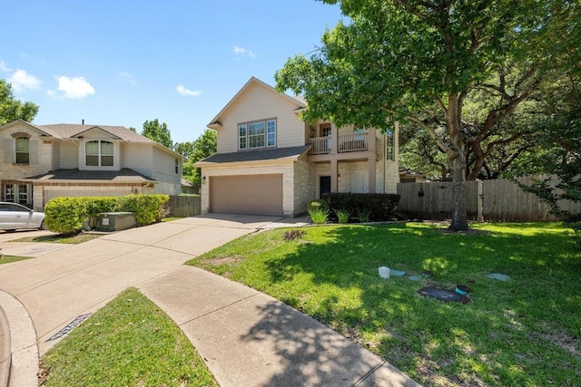 10216 Chaska Cv, Austin, TX 78739 - view of front facade with a garage, concrete driveway, and a balcony