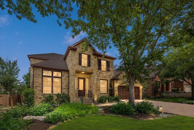 12920 Little Dipper Path, Austin, TX 78732 - traditional home with stone siding, driveway, and a garage