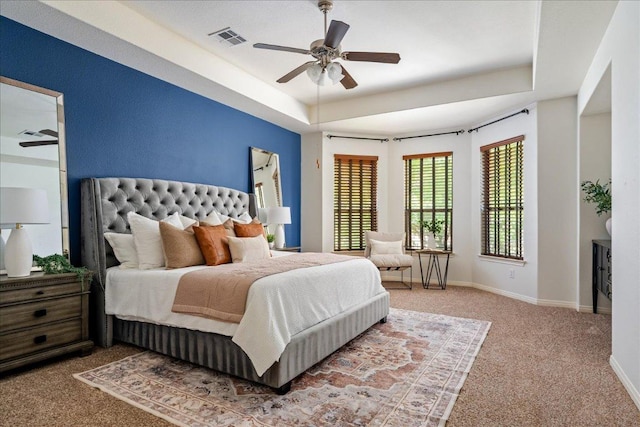 12920 Little Dipper Path, Austin, TX 78732 - bedroom featuring carpet flooring, a raised ceiling, baseboards, and ceiling fan