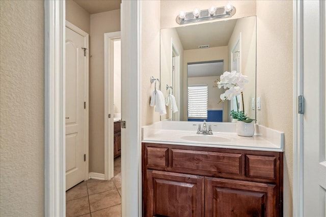 12920 Little Dipper Path, Austin, TX 78732 - bathroom featuring vanity and tile patterned flooring