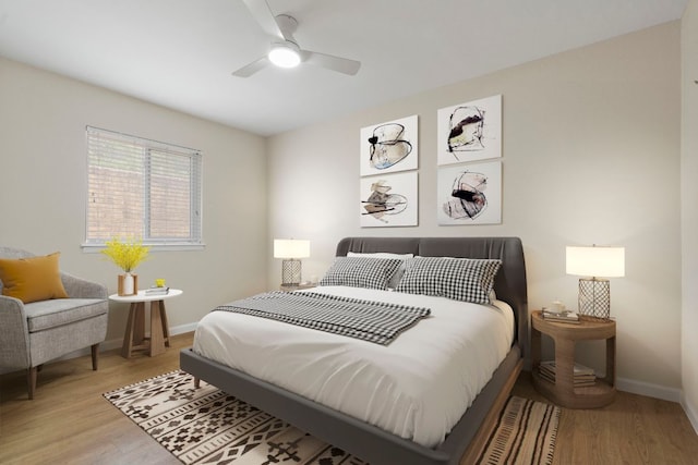 2401 Manor Rd Unit 235, Austin, TX 78722 - bedroom with light wood-style flooring, baseboards, and a ceiling fan