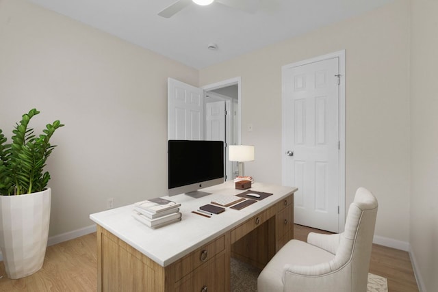 2401 Manor Rd Unit 235, Austin, TX 78722 - office area with baseboards, light wood-type flooring, and a ceiling fan