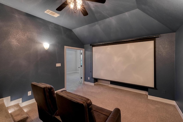 cinema with ceiling fan, vaulted ceiling, carpet floors, and baseboards