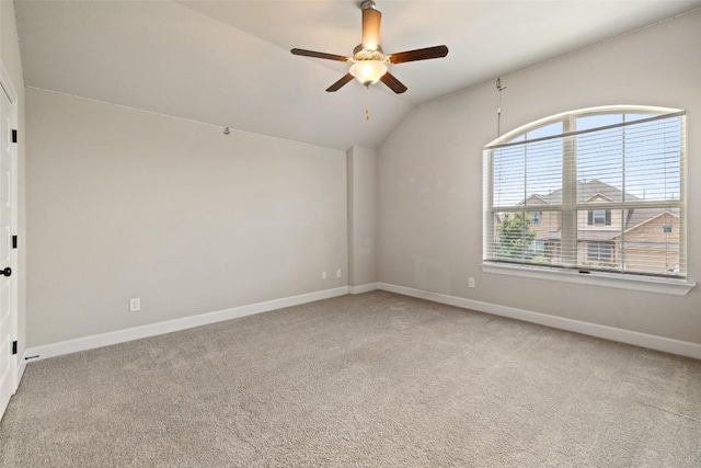 3351 Vasquez Pl, Round Rock, TX 78665 - spare room featuring vaulted ceiling, a ceiling fan, and light colored carpet