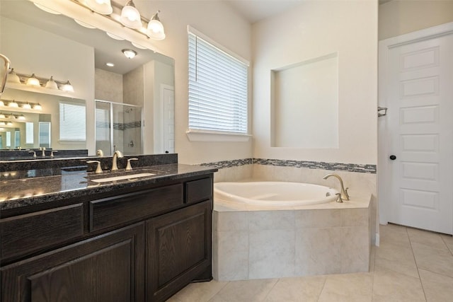 3351 Vasquez Pl, Round Rock, TX 78665 - bathroom with a shower stall, tile patterned flooring, a bath, and vanity
