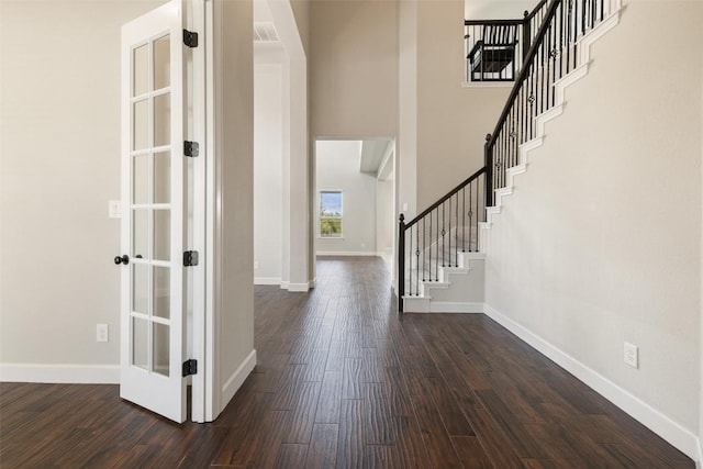 3351 Vasquez Pl, Round Rock, TX 78665 - foyer featuring stairway, dark wood-type flooring, and a high ceiling