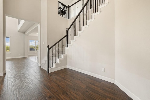 3351 Vasquez Pl, Round Rock, TX 78665 - stairway with a towering ceiling and wood finished floors