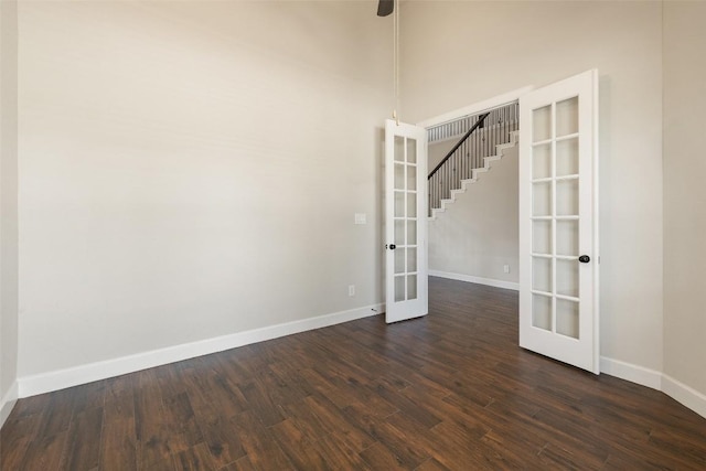 3351 Vasquez Pl, Round Rock, TX 78665 - spare room with french doors, dark wood-style floors, and stairway