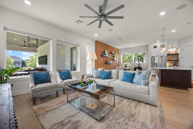 105 Monterey Oak Trl, Georgetown, TX 78628 - living area featuring light wood-style floors, ceiling fan, and recessed lighting