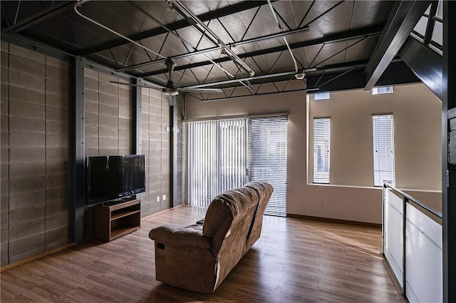 living room with wood finished floors and baseboards