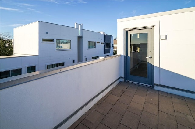 view of patio featuring a balcony