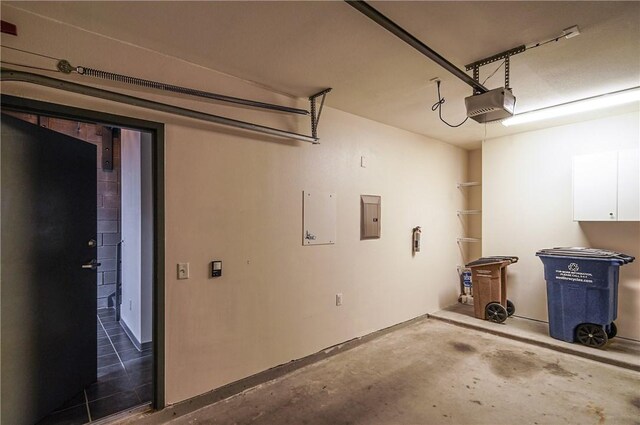 garage featuring a garage door opener and electric panel