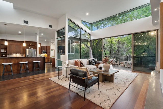 5804 Kaelan Cv, Austin, TX 78730 - living room with a high ceiling, dark wood-style floors, expansive windows, and recessed lighting