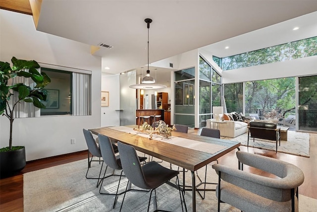5804 Kaelan Cv, Austin, TX 78730 - dining space featuring wood finished floors, recessed lighting, and a sunroom