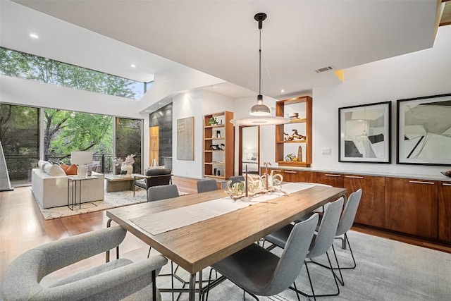 5804 Kaelan Cv, Austin, TX 78730 - dining area featuring light wood finished floors and recessed lighting