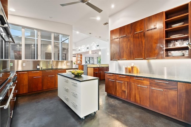 5804 Kaelan Cv, Austin, TX 78730 - kitchen with modern cabinets, finished concrete floors, a sink, ceiling fan, and lofted ceiling