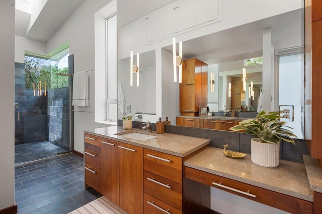 5804 Kaelan Cv, Austin, TX 78730 - bathroom with tile patterned floors, walk in shower, and vanity