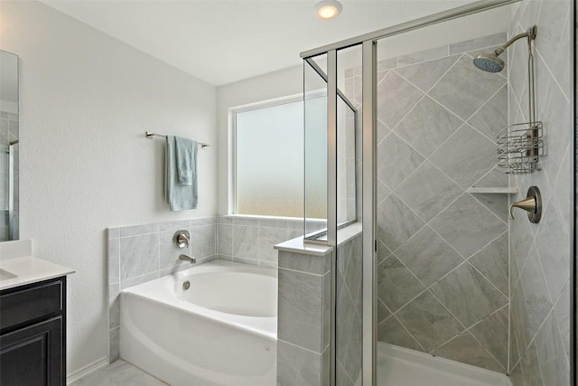 270 Johnny Cake Dr, Kyle, TX 78640 - bathroom with vanity, a shower stall, and a bath