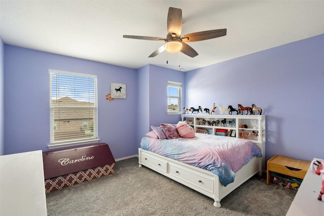 270 Johnny Cake Dr, Kyle, TX 78640 - carpeted bedroom with multiple windows and ceiling fan