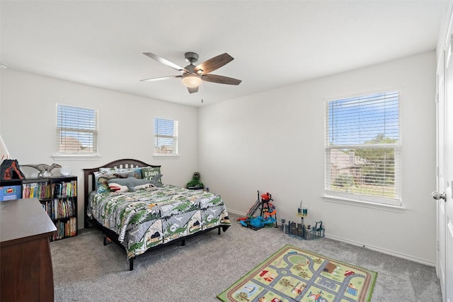 270 Johnny Cake Dr, Kyle, TX 78640 - carpeted bedroom with ceiling fan and baseboards