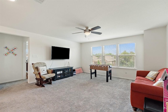 270 Johnny Cake Dr, Kyle, TX 78640 - living area featuring carpet, a ceiling fan, and baseboards