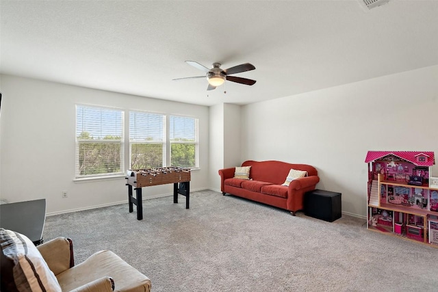 270 Johnny Cake Dr, Kyle, TX 78640 - living room with carpet floors, ceiling fan, and baseboards