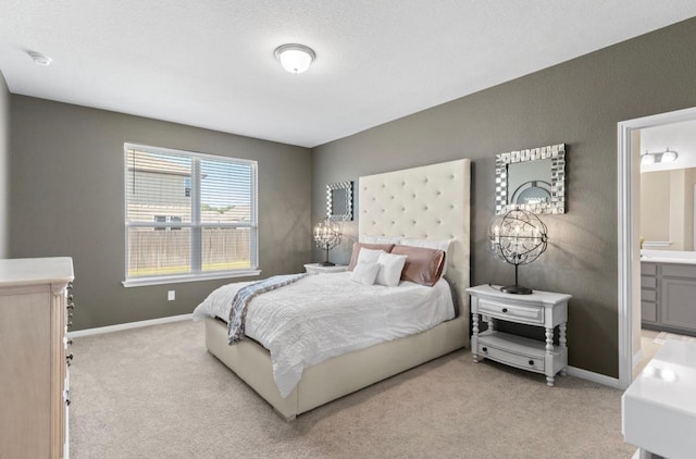 246 Salt Springs Rd, Kyle, TX 78640 - bedroom featuring light colored carpet and ensuite bath