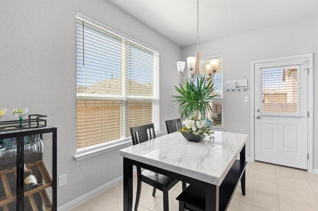 246 Salt Springs Rd, Kyle, TX 78640 - dining area with a chandelier, healthy amount of natural light, and light tile patterned floors