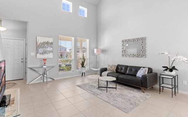 246 Salt Springs Rd, Kyle, TX 78640 - living room with a high ceiling and tile patterned floors